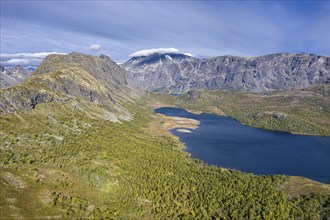 Aerial view of lake Ovre Leirungen, Mt. Besshø (or Besshøe) and famous Besseggen ridge in the back,