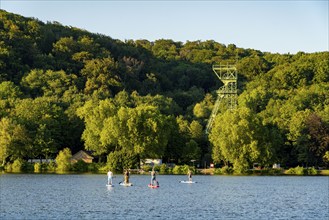 Lake Baldeney, stand up paddler, Sup, headframe of the former Carl Funke colliery in Heisingen,