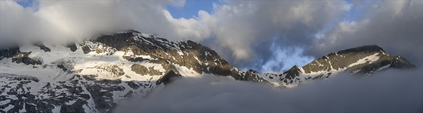 Panorama, cloudy mountain landscape with summit Hochsteller and Griesferner with snow and glacier,