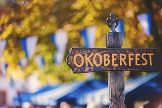 Sign with text 'Oktoberfest' at entry of traditional Bavarian German festival. Generative AI, AI