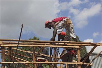 South Ethiopia, two men on a building site, house building, wooden construction, Ethiopia, Africa