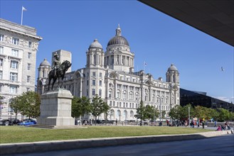 Equestrian statue in front of a magnificent historic building in sunny weather, Liverpool