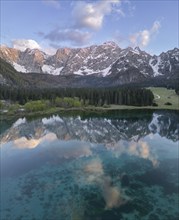 Aerial view of Lago Fusine with the Mangart massif in the background, Tarvisio, province of Udine,