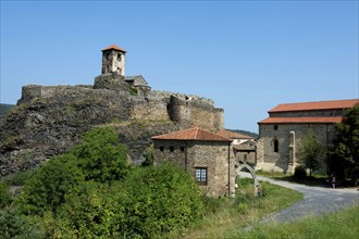 Medieval castle perched on a volcanic peak in Saint-Ilpize overlooking the Haut-Allier valley,