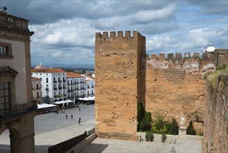 Medieval wall in a town with squares and buildings, view of Plaza Mayor, fortress wall, Cáceres,