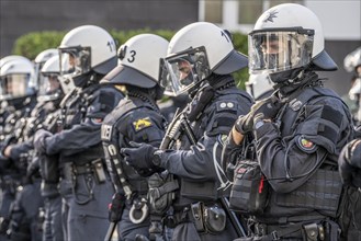 Police officers, police task force, on duty at the demonstration against the AFD party conference