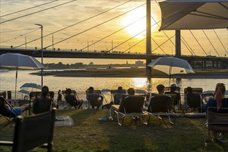 The city beach on the Rhine near Düsseldorf, riverside promenade, by the Rheinkniebrücke bridge,