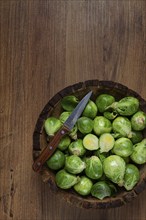 Fresh Brussels sprouts, raw, top view, on a wooden table, no people