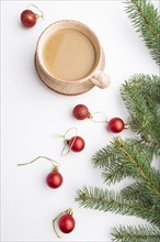 Christmas or New Year composition. Decorations, red balls, fir and spruce branches, cup of coffee,