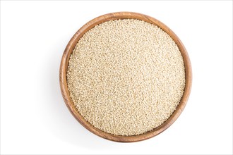 Wooden bowl with raw white quinoa seeds isolated on white background. Top view, flat lay