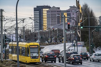 Ruhrbahn tram, on Altendorfer Straße, in the background the town hall of Essen, rush hour, evening