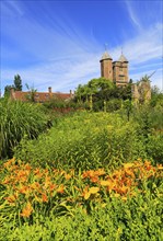 Red brick tower and blue sky Sissinghurst castle gardens, Kent, England, UK