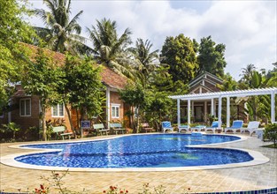 Swimming pool with blue water at the tropical hotel in Vietnam