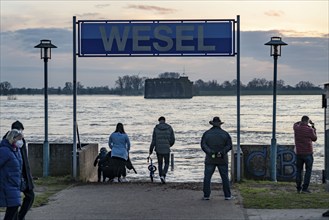 Rhine flood, riverside promenade in Wesel, the river water is already spilling onto the paths,