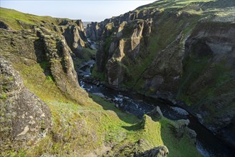 Fjaðrárgljúfur Canyon, Fjadrargljufur, rock formations in rugged deep canyon with river in the