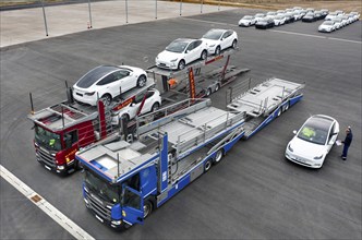 Tesla Y models produced in the Tesla Giga Factory are loaded onto car transporters, Grünheide, 24