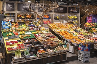 Market stall with a wide range of different tropical fruits in the Markthalle Stuttgart,