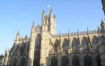 English flag flying on the tower of the Abbey church, Bath, Somerset, England, United Kingdom,