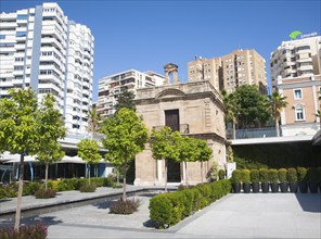 Old chapel surrounded by newly redeveloped port area of shops and bars Malaga, Spain, Muelle dos,