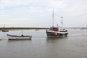 Lady Florence river cruise restaurant boat approaching quay, River Ore, Orford, Suffolk, England,