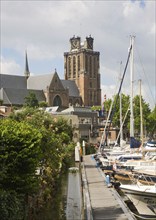 Grote Kerk cathedral church and boats in Nieuwe Haven, Dordrecht, Netherlands