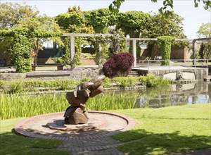 Sculpture water feature and gardens in Queen's Park, central Swindon, Wiltshire, England, UK