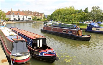 Narrow boats on the River Great Ouse, Ely, Cambridgeshire, England, UK