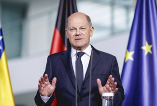 Olaf Scholz, Federal Chancellor, speaks at a press conference during the visit of Denis Becirovic,