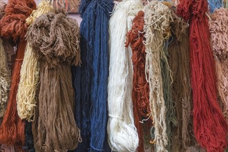 Colourful carpet yarns in a carpet factory, Turkey, Asia