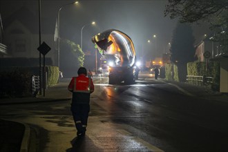 Transport of a 68 metre long, 22 tonne blade of a wind turbine, here in Breckerfeld, with a