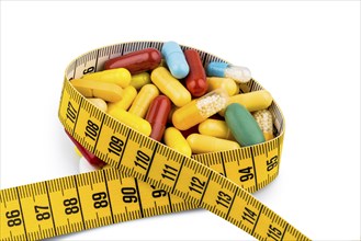 Tablets and tape, symbolic photo of appetite suppressants, diet pills and slimming mania, Studio