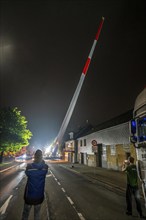 Transport of a 68 metre long, 22 tonne blade of a wind turbine, here in Breckerfeld, with a