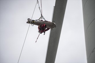 Height rescuers from the Oberhausen professional fire brigade practise abseiling from a wind