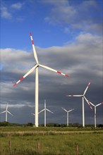 Wind turbines in front of a stormy sky, East Frisia, Lower Saxony, Federal Republic of Germany,