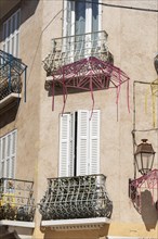 Small balconies and white shutters in the old town centre of Sainte-Maxime, Provence-Alpes-Côte