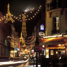 Christmas lights with the Eiffel Tower in the background, Paris, France, Europe