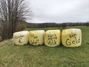 Billions of euros for the world, no money for our own people, farmers protest on bales of grass