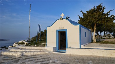 Profitis Ilias Chapel, Small white chapel in front of a rural landscape with blue sky and