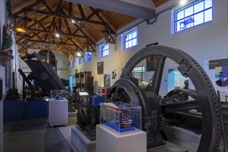 Vintage dynamo and old machines in the Industrial Museum at the Le Bois du Cazier coal mine,