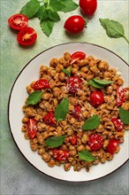 Tuscan pasta with smoked paprika and basil, parmesan cheese, Italian traditional cuisine