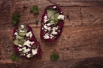 Sandwiches with beetroot hummus, cucumber and blue cheese, microgreens, rye bread, breakfast,