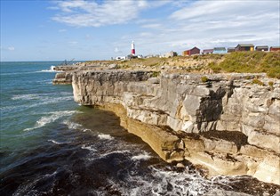 Red and white lighthouse on the coast at Portland Bill, isle of Portland, Dorset, England, United