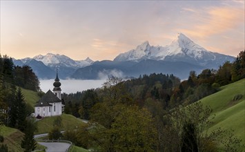 Maria Gern pilgrimage church at sunrise, behind Schönfeldspitze and the Watzmann, in autumn,