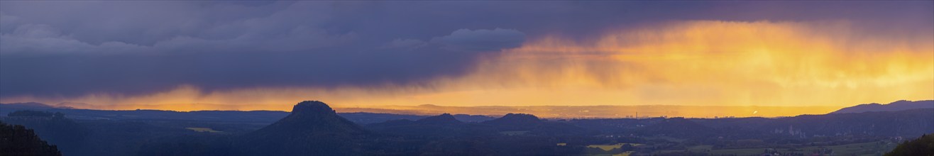 View from the Carolafelsen over Pirna to Dresden. Sunset and rain showers, Bad Schandau, Saxony,