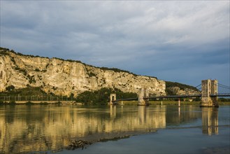 Old suspension bridge over the Rhone and rocks, Passerelle Marc Seguin, Tain-l'Hermitage,