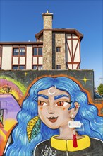 Colourful graffito of a woman with blue hair, street art in the city of Punta Arenas, Patagonia,