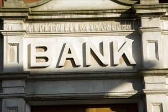 Stone lettering Bank above entrance to building, England, UK