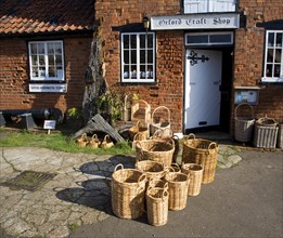 Wicker baskets outside craft shop, Orford, Suffolk, England, United Kingdom, Europe