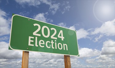 2024 election just ahead green road sign over clouds and blue sky