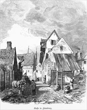 Alley in Flensburg, Schleswig-Holstein, alleyway scene, cobblestones, horse, woman, clothesline,